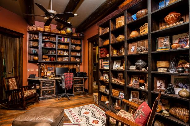 Rustic Office Space Filled With Dark Wooden Built-Ins and Knickknacks