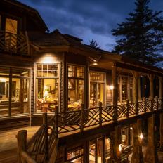 Upper Deck and Rustic Mountain Retreat Glowing at Nighttime