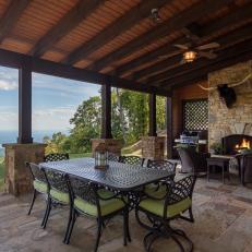 Luxurious Covered Dining Patio With Outdoor Fireplace and Mountain Views