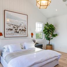 Airy Master Bedroom With Vertical Shiplap Accent Wall