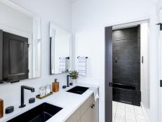 Black-and-White Palette in Hall Bathroom Creates Sleek Aesthetic