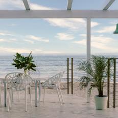 Beachfront Deck With White Chairs