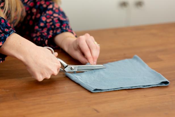 Upcycle an old shirt into a handy drawstring pouch perfect for traveling or quick errands.