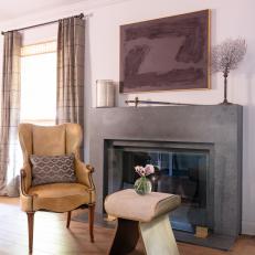 Leather Armchair and Gray Fireplace