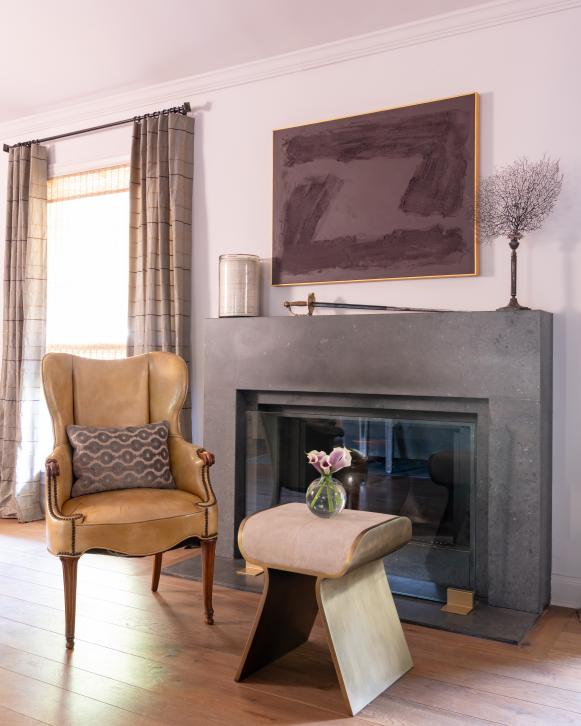 Armchair and Gray Fireplace