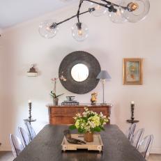 Eclectic Dining Room With Round Mirror
