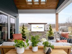 Covered Deck Includes Concealed TV That Rises From a Stone Cabinet