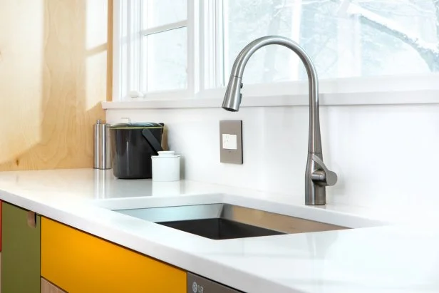 Kohler faucet and sink in a remodeled midcentury kitchen.
