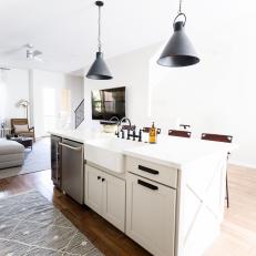 Transitional Open Plan Kitchen With Gray Pendants