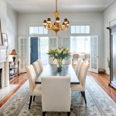 Transitional Dining Room With Marble Fireplace