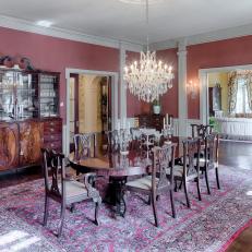 Red Traditional Dining Room With Crystal Chandelier