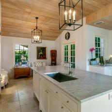 Traditional Kitchen With Wood Ceiling and White Walls