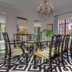 Transitional Dining Room With Bold Rug