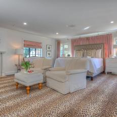 Expansive Master Bedroom With Leopard Print Carpet