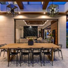 Modern Outdoor Dining Room With Cube Pendants