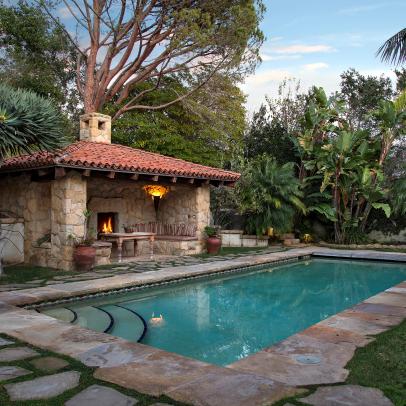 Private Swimming Pool With Poolside Cabana Fireplace and Stone Pavers