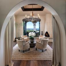 Arched Opening Leading to Cozy Lounge In California Villa
