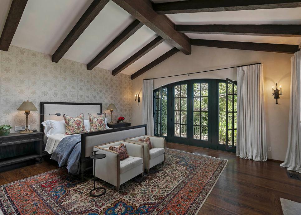 Expansive Master Bedroom With Exposed-Beam Ceiling in Mission-Style