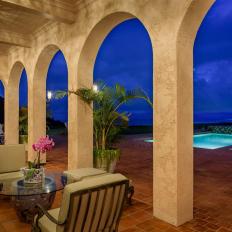 Covered Patio With Arches and Pool