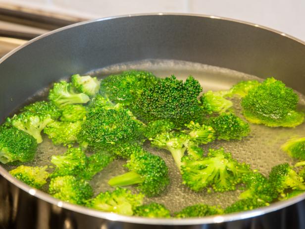 Boiling broccoli for a short  amount of time in water will help seal in flavor before you freeze it.