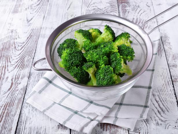 Drain broccoli in a colander after blanching to remove all water.