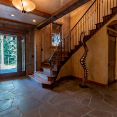 Rustic Foyer With Sculpture