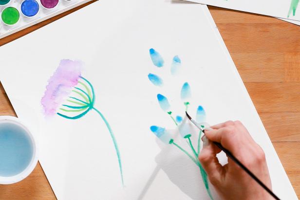 Use green paint and a smaller brush to add stems under each petal to finish your bluebell flower.