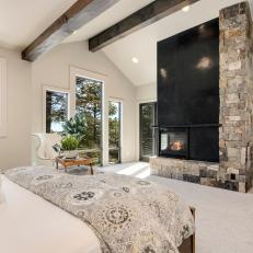 Light, Bright and Airy Master Bedroom With Modern Stone and Metal Fireplace