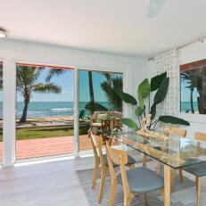 Beachfront Dining Room With Glass Table