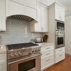 White Chef Kitchen With Wooden Spoons