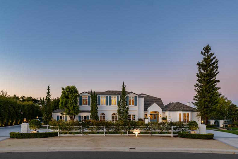 Sunset Exterior View of French Farmhouse Estate, Privacy Fence Outside