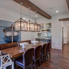 Modern Farmhouse Dining Room With Exposed Beams and Farm Table