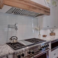 A Beautiful Stainless Steel Gas Range in a Farmhouse Kitchen