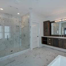 Traditional Bathroom With Dual Glass Shower and Marble Floors
