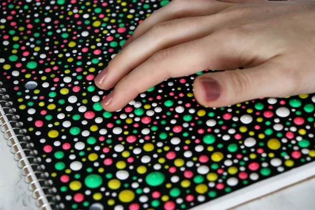 Let dry completely. Once dry, the puffy paint dots make a nice texture to run your hands over while working or studying.