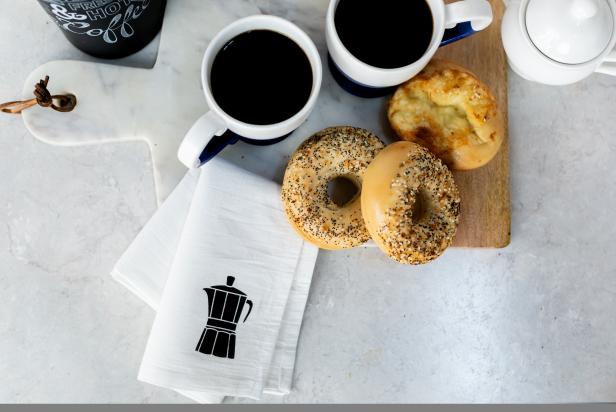 Stenciled Tea Towel With Coffee Pot Icon Beside Coffee and Bagels