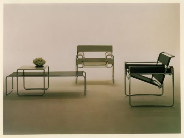 Nesting Laccio tables stand beside two Wassily lounge chairs.