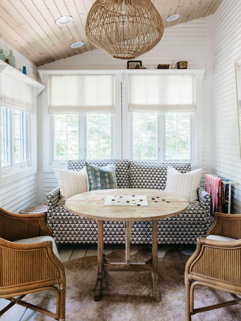 This “room of memories,” as Kate calls it, was originally a porch, but she opened the space up and reinsulated it to create a nook for playing games. The vintage Kate Marker Home chairs are so cozy (and peep the rattan pendant) that it’s easy for Kate and her family to disconnect from technology and spend quality time together in this space. Bonus: The patterned TK sofa folds out creating ample sleeping room for renters and guests.