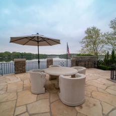 Waterfront Patio With Rounded Chairs