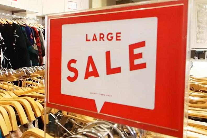 Red Sign That Reads "Large Sale"