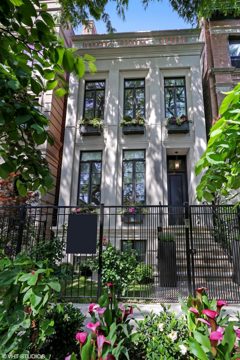 Wrought Iron Gate at to Lincoln Park Home With Limestone Facade