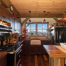 Rustic Open Plan Kitchen With Red Fan