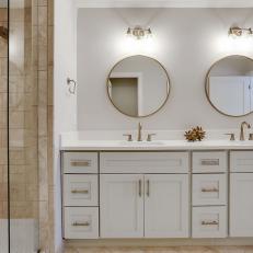 Double Vanity Bathroom Featuring Two Circle Mirrors