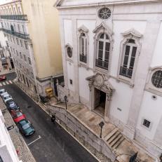 A Bird's-Eye View of a Stone Penthouse in Lisbon Overlooks a Busy Street