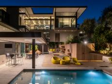 Modern Mansion Features a Backyard Swimming Pool and Covered Patio