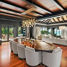 A Modern Dining Room Features Wood Ceilings With Exposed Beams and Outdoor Views