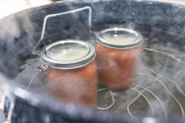 canning jars in a pot at rolling boil