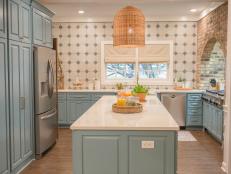 As seen on Home Town, the Keith residence has been fully renovated by Ben and Erin Napier. The new kitchen now boasts all new cabinetry, backsplash, light fixtures, and flooring. (After matches Before #12)