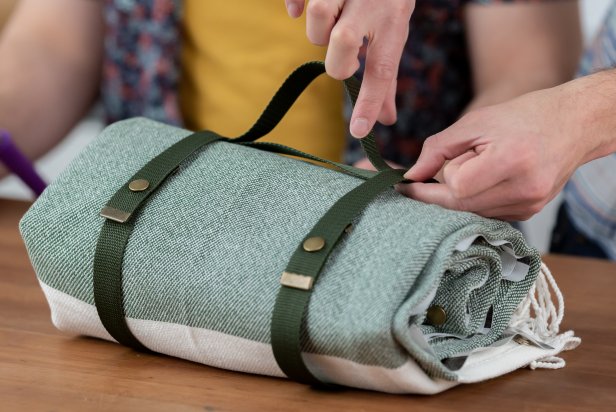 For the handle, measure out and cut two nylon straps to carry the blanket. Cut one the exact size of the width, and cut the other just a little bit longer.