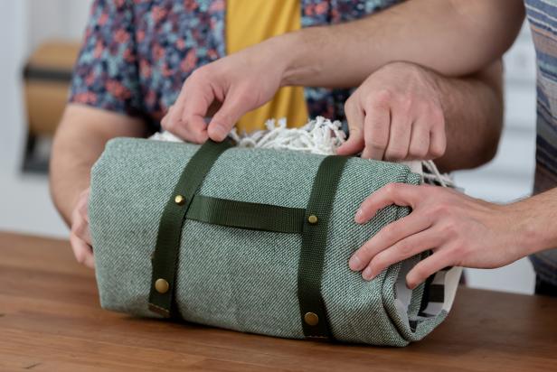 Using heavy duty pliers, punch through all three layers of the nylon straps to connect everything together. Then screw in the brass purse feet by hand into the holes to keep everything together. Now roll it up, pack a picnic and enjoy.